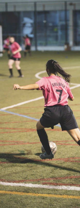 woman-in-red-and-white-soccer-jersey-shirt-and-black-shorts-running-on-field-during-daytime.jpg woman in red and white soccer jersey shirt and black shorts running on field during daytime