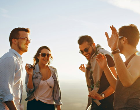 three-men-and-one-woman-laughing-during-daytime.jpg three men and one woman laughing during daytime
